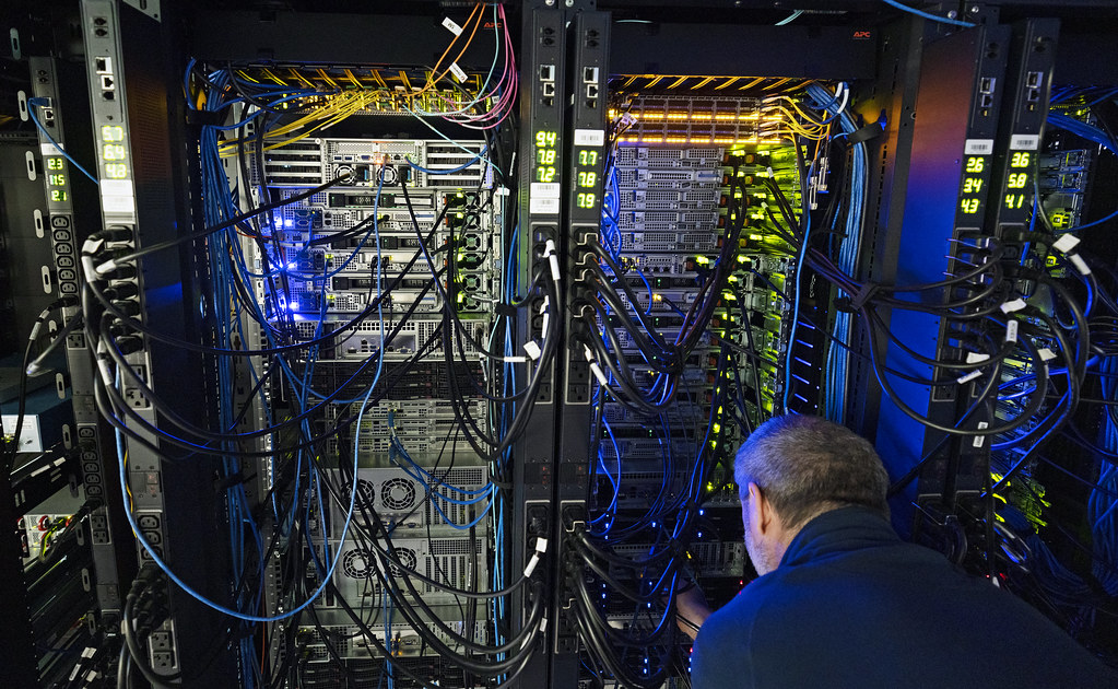Engineer working in a server rack